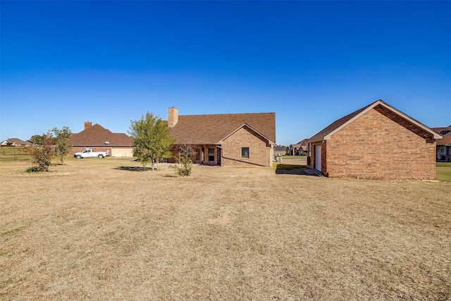 rear view of property with a garage