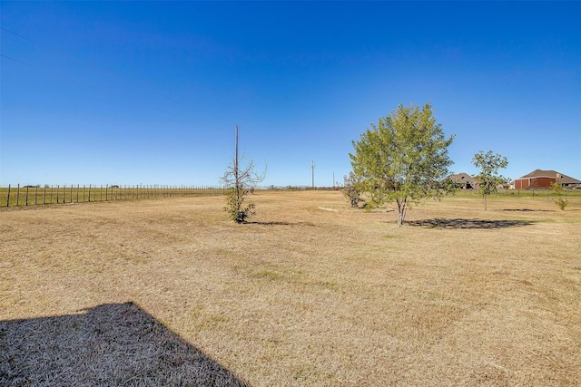 view of yard with a rural view