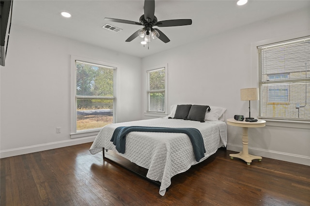 bedroom featuring ceiling fan and dark hardwood / wood-style flooring