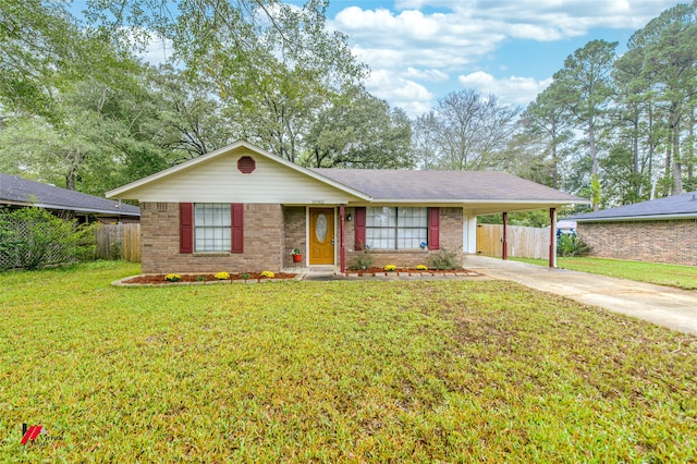 ranch-style home featuring a front lawn and a carport