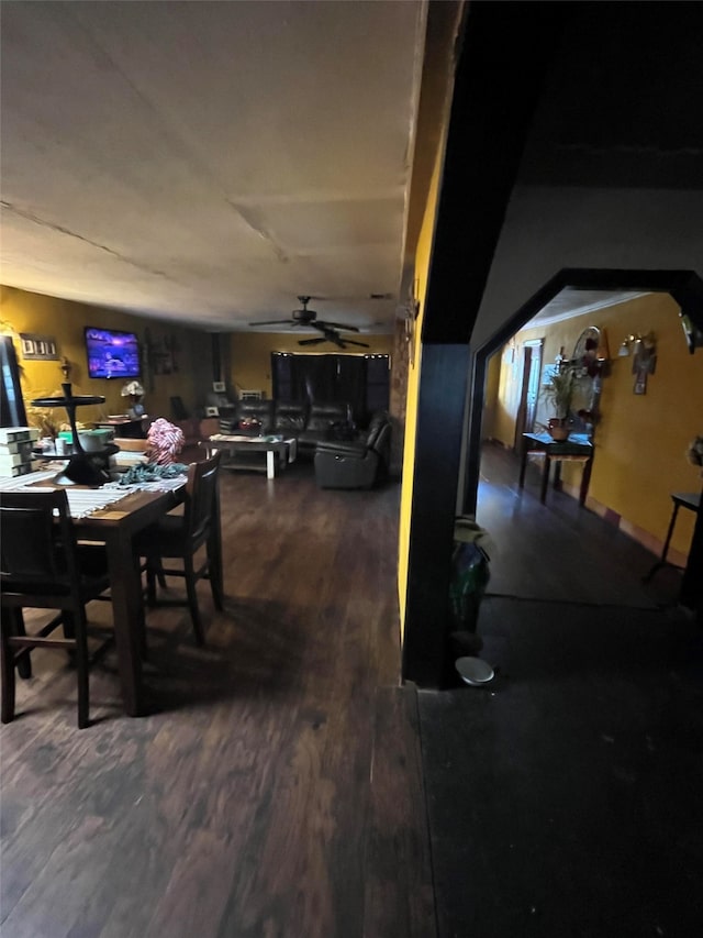 dining area featuring dark hardwood / wood-style floors and ceiling fan