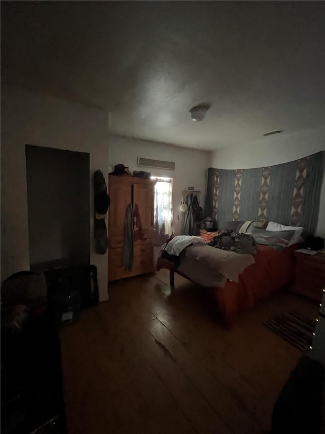 bedroom with wood-type flooring