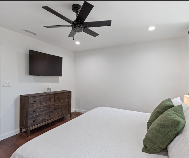 bedroom featuring ceiling fan and dark hardwood / wood-style flooring