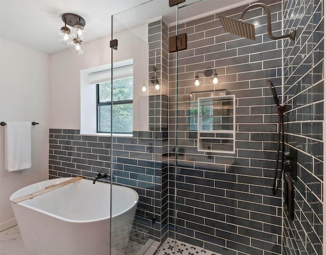 bathroom with tile walls and plus walk in shower