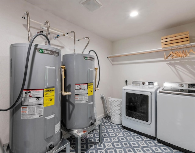 clothes washing area with water heater and washer and clothes dryer