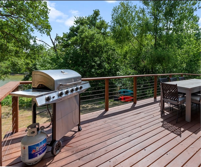 wooden deck featuring area for grilling