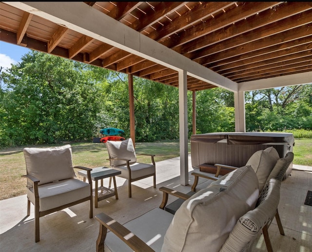 view of patio / terrace with a hot tub