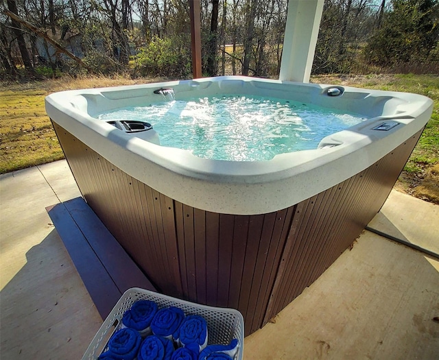 view of pool with a hot tub