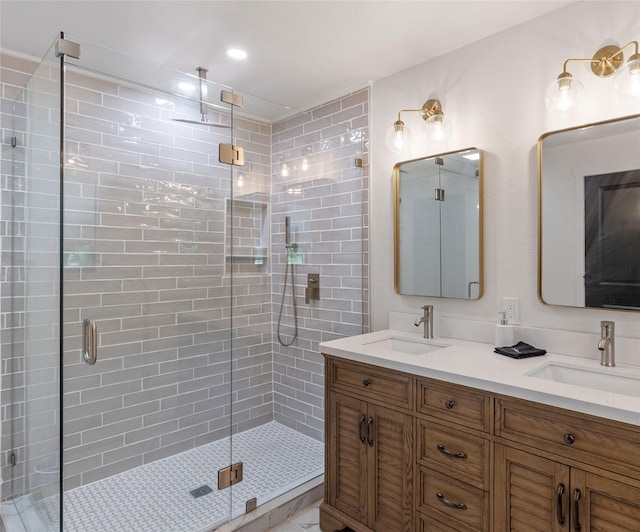 bathroom with an enclosed shower and vanity