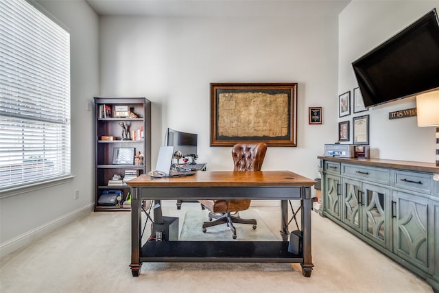 home office featuring light colored carpet