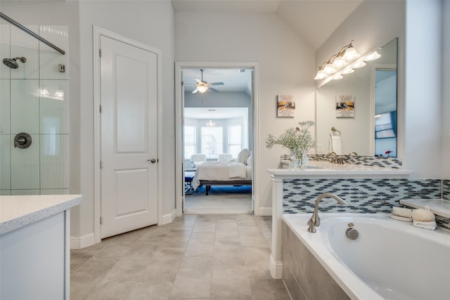 bathroom with ceiling fan with notable chandelier, tile patterned floors, separate shower and tub, vaulted ceiling, and vanity