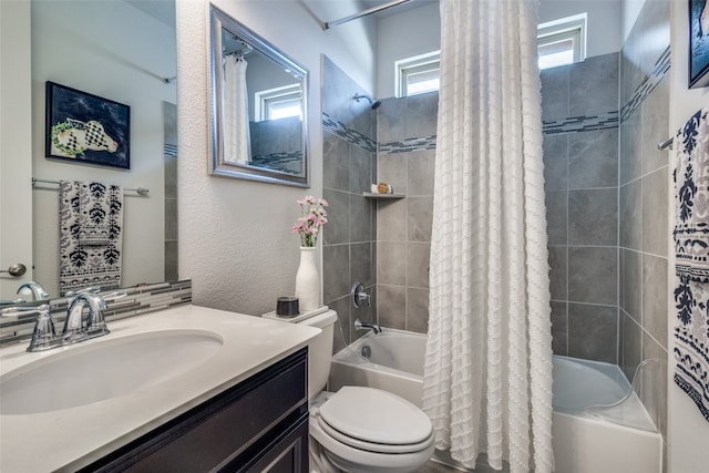 full bathroom with vanity, shower / bath combination with curtain, and toilet