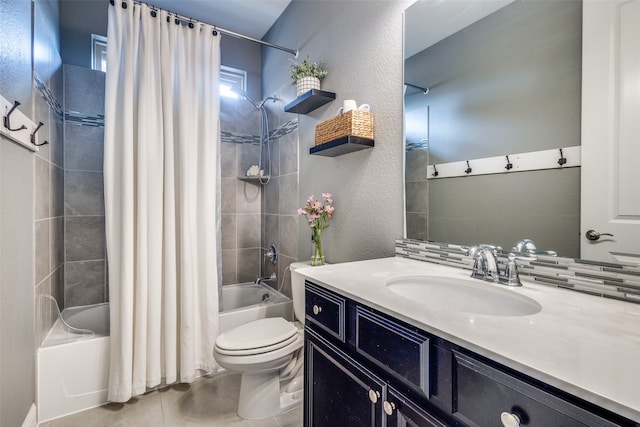 full bathroom featuring tile patterned flooring, vanity, toilet, and shower / tub combo with curtain