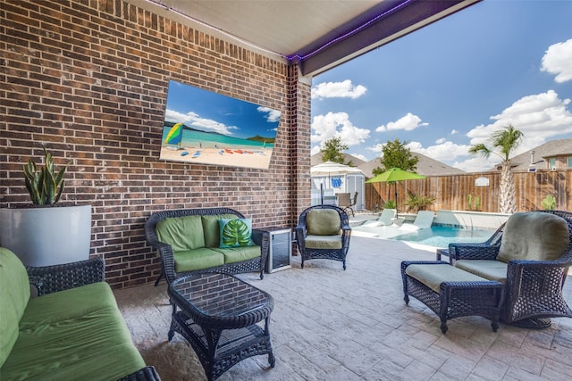 view of patio / terrace featuring outdoor lounge area and a fenced in pool