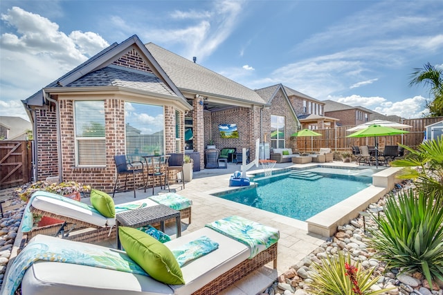 view of swimming pool featuring an outdoor living space and a patio area