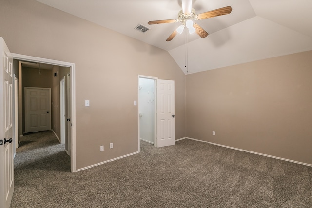 unfurnished bedroom featuring lofted ceiling, ceiling fan, and dark carpet