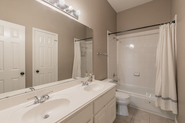 full bathroom featuring vanity, tile patterned floors, shower / bath combo, and toilet