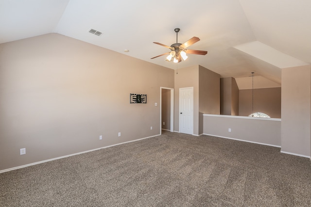 unfurnished room with carpet, ceiling fan, and vaulted ceiling