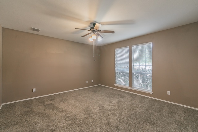 unfurnished room with carpet flooring and ceiling fan