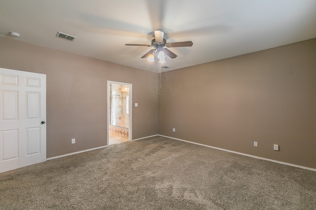 unfurnished room featuring ceiling fan and carpet floors