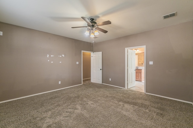 unfurnished bedroom featuring ceiling fan and light colored carpet