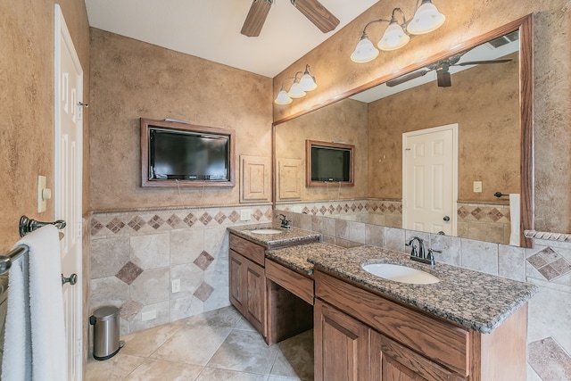 bathroom featuring vanity, ceiling fan, tile patterned floors, and tile walls