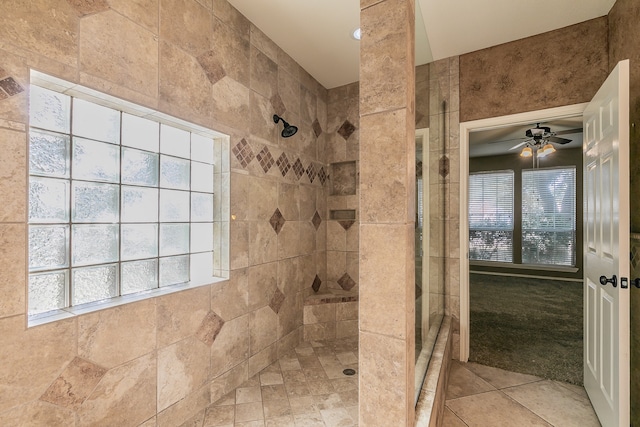 bathroom featuring tiled shower and ceiling fan