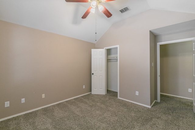 unfurnished bedroom featuring dark colored carpet, ceiling fan, and vaulted ceiling