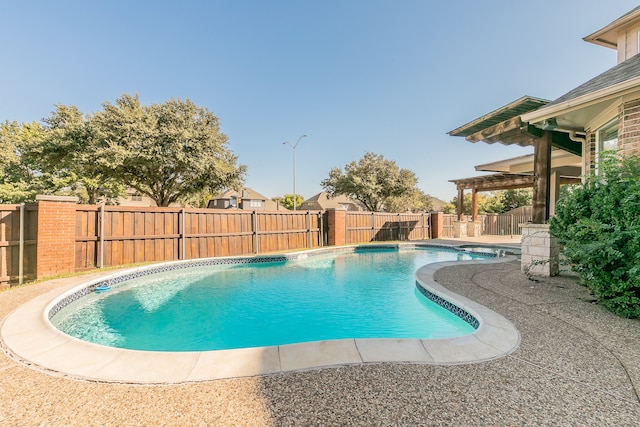 view of swimming pool with a patio area and a pergola