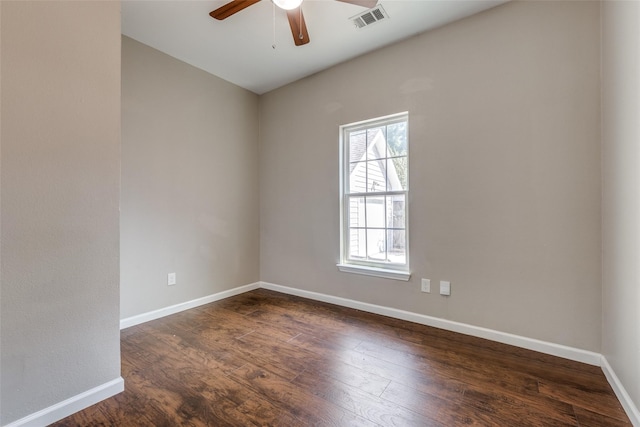 spare room featuring dark hardwood / wood-style flooring and ceiling fan