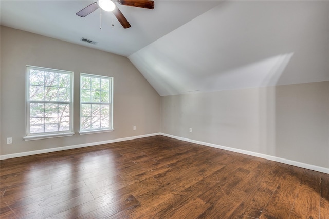 additional living space featuring vaulted ceiling, ceiling fan, and dark hardwood / wood-style flooring