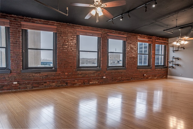 unfurnished room featuring plenty of natural light and light hardwood / wood-style floors