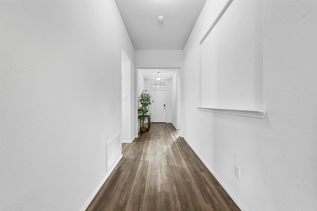 hall featuring dark wood-type flooring