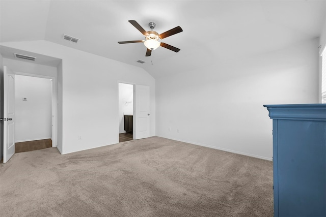 unfurnished living room with carpet flooring, ceiling fan, and vaulted ceiling