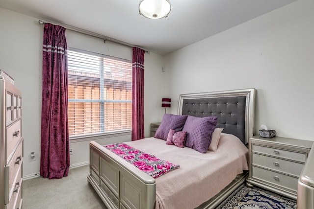 bedroom with light colored carpet