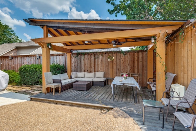 view of patio featuring an outdoor living space, ceiling fan, and a deck