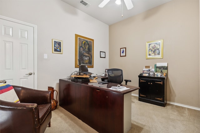 carpeted office featuring ceiling fan