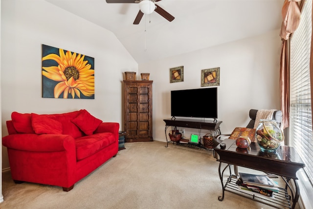 living room featuring lofted ceiling, ceiling fan, and carpet floors