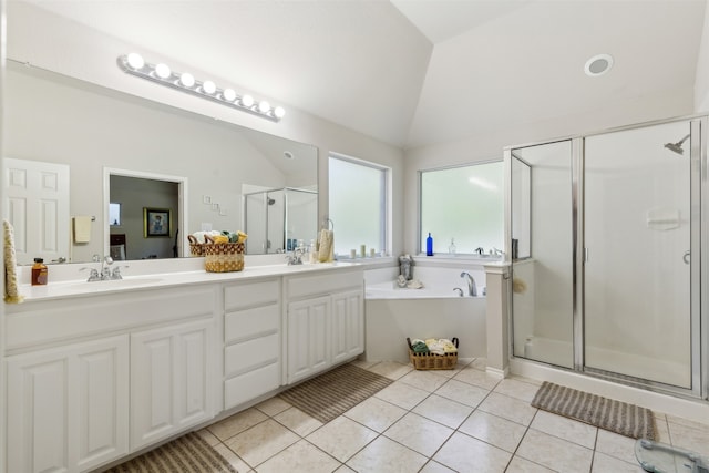 bathroom featuring vanity, walk in shower, tile patterned flooring, and lofted ceiling