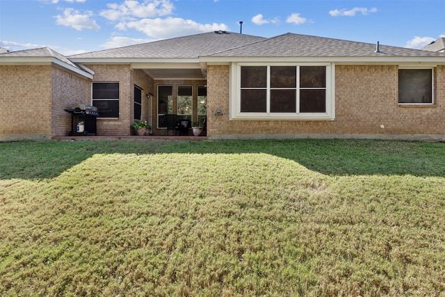 back of house with a yard