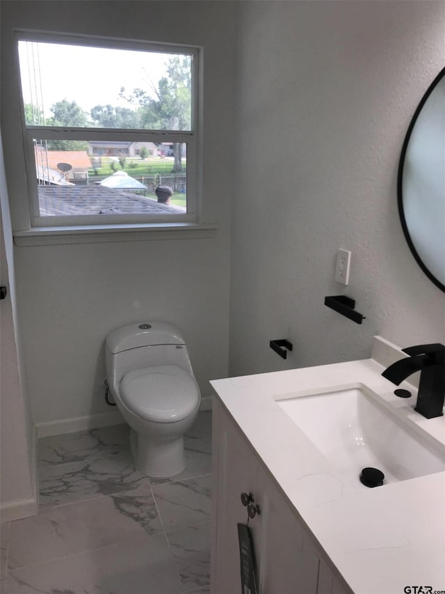 bathroom with vanity and toilet