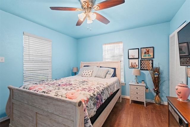 bedroom featuring dark hardwood / wood-style flooring, a closet, and ceiling fan