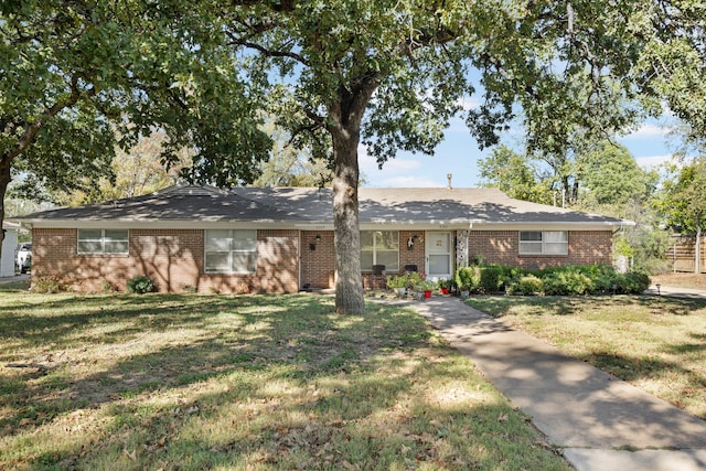 ranch-style house with a front yard