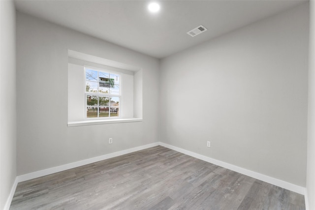 spare room with light wood-type flooring