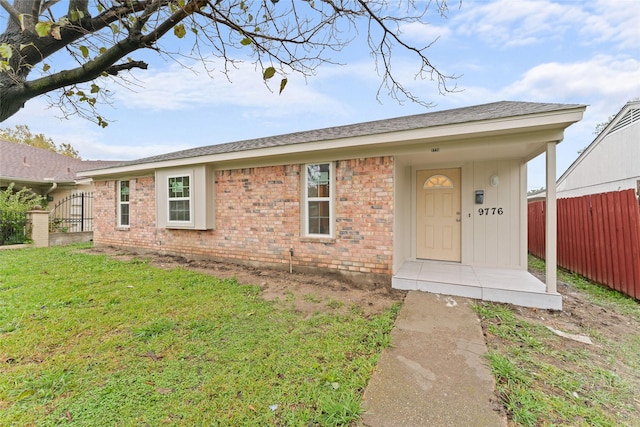 ranch-style home with a front yard