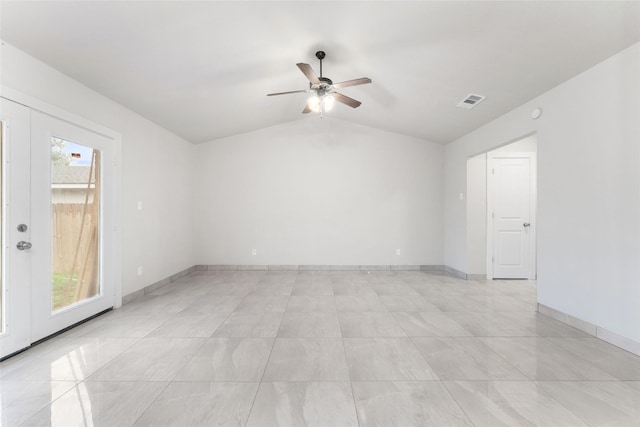 empty room featuring vaulted ceiling and ceiling fan