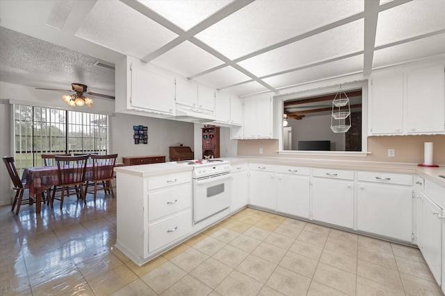 kitchen with white cabinetry, a textured ceiling, kitchen peninsula, ceiling fan, and white range with electric stovetop