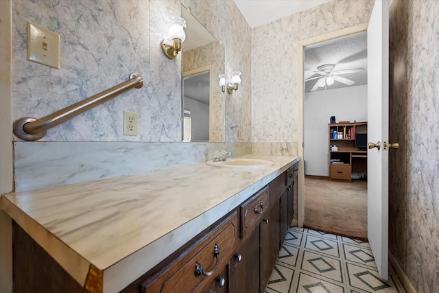 bathroom featuring ceiling fan and vanity