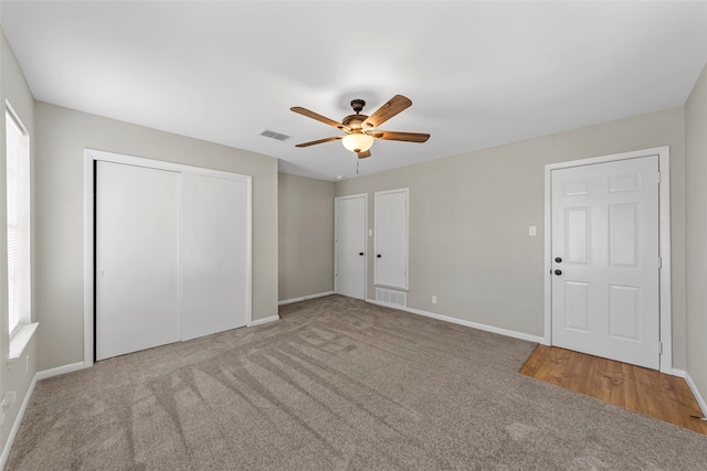 unfurnished bedroom featuring carpet and ceiling fan