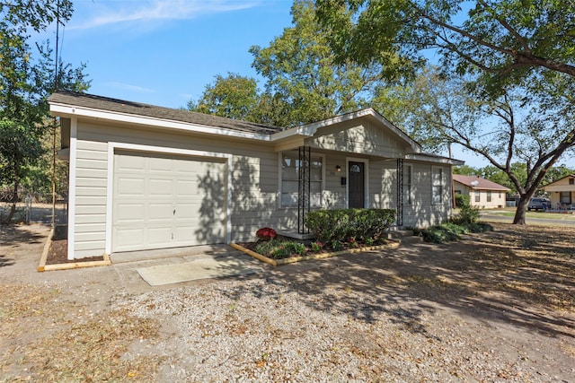 single story home with a porch and a garage